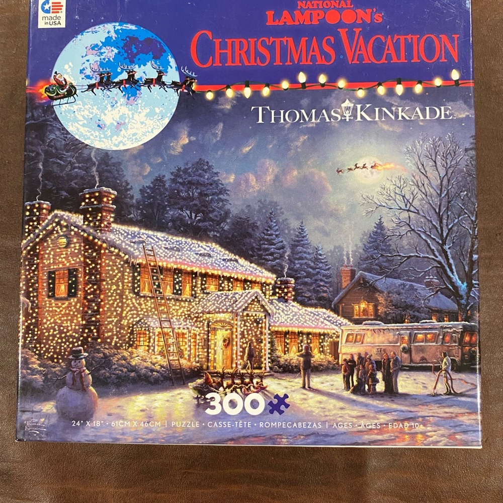 Thomas Kinkade Christmas Vacation Puzzle with Blue and Gold Accents